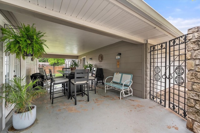 1410 Hummingbird Dr, Hillsboro, TX 76645 - view of patio / terrace featuring fence and outdoor dining space