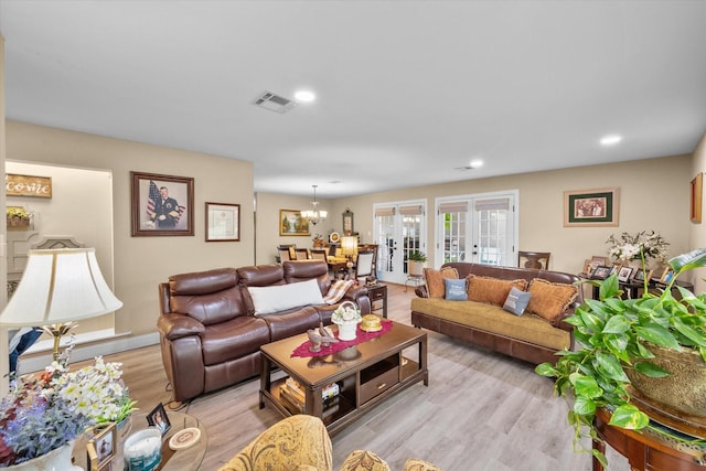 1410 Hummingbird Dr, Hillsboro, TX 76645 - living area with recessed lighting, light wood-style flooring, a chandelier, visible vents, and french doors