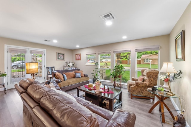 1410 Hummingbird Dr, Hillsboro, TX 76645 - living room featuring baseboards, visible vents, wood finished floors, and recessed lighting