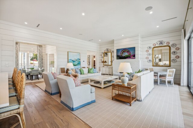 14600 Kiawah, Malakoff, TX 75148 - living area featuring light wood-type flooring, wood walls, and recessed lighting
