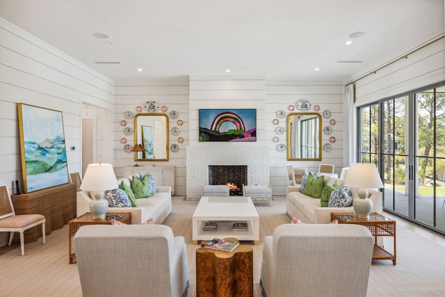 14600 Kiawah, Malakoff, TX 75148 - living room featuring ornamental molding, light carpet, wooden walls, and a brick fireplace