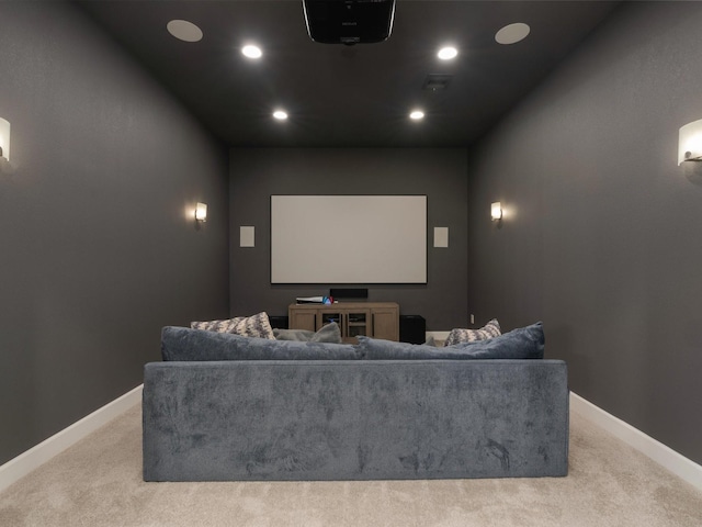 carpeted cinema with recessed lighting and baseboards