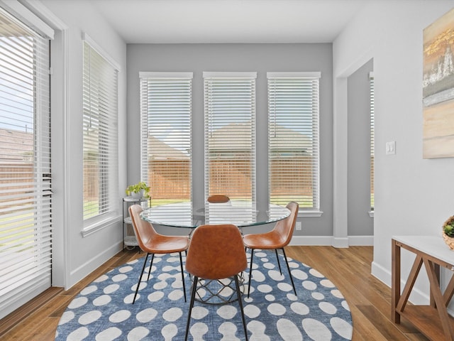 dining room with wood finished floors and baseboards