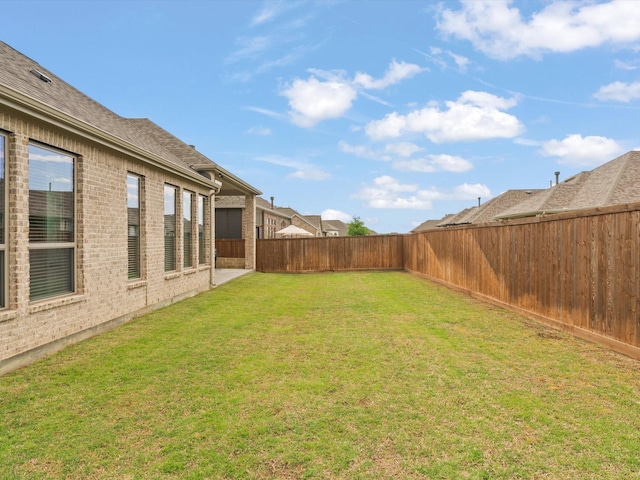 view of yard featuring a fenced backyard