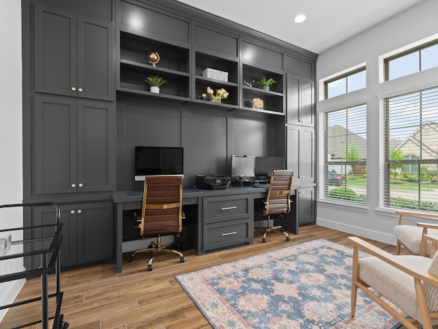 office area featuring recessed lighting, built in study area, and light wood-style flooring