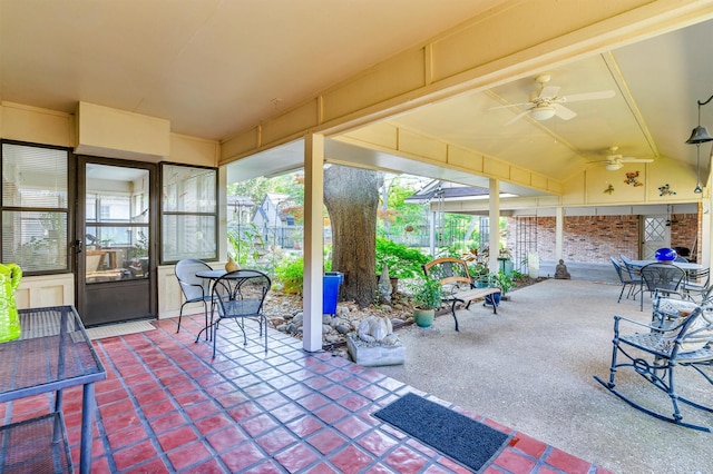 view of patio / terrace with fence and a ceiling fan