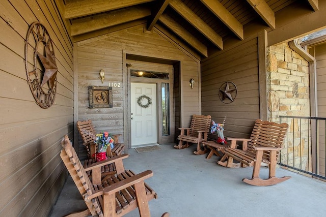 entrance to property featuring a porch