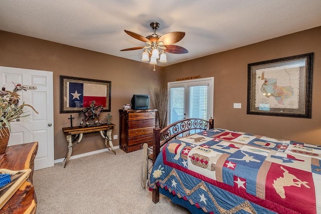 bedroom with baseboards, a ceiling fan, and light carpet