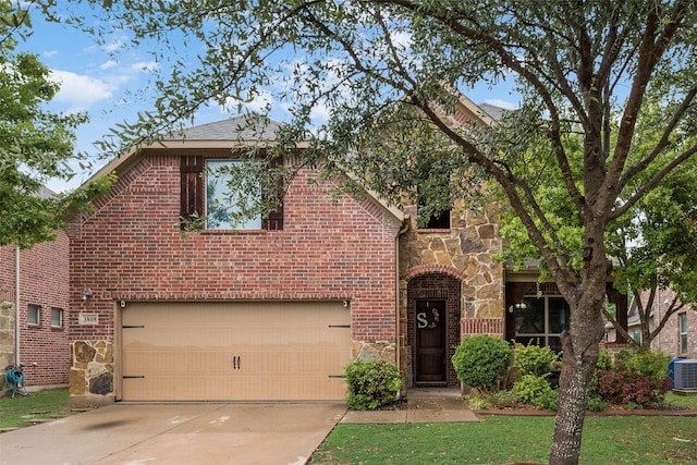 traditional home with a garage, stone siding, central AC, brick siding, and concrete driveway