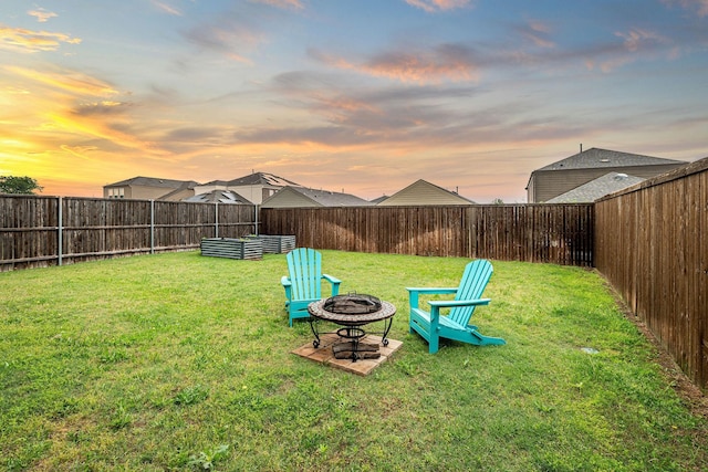 7516 Continental Dr, Mckinney, TX 75071 - yard at dusk with a fire pit and a fenced backyard