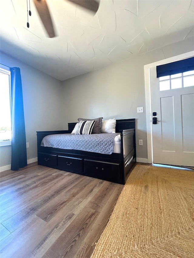 712 State Highway 67, Graham, TX 76450 - bedroom with wood finished floors and baseboards