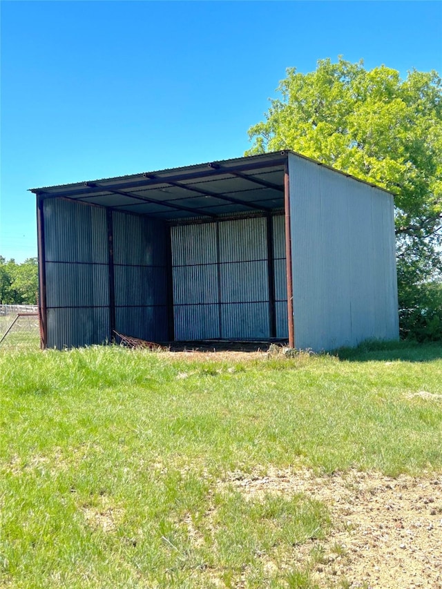 712 State Highway 67, Graham, TX 76450 - view of pole building featuring a lawn and a detached carport