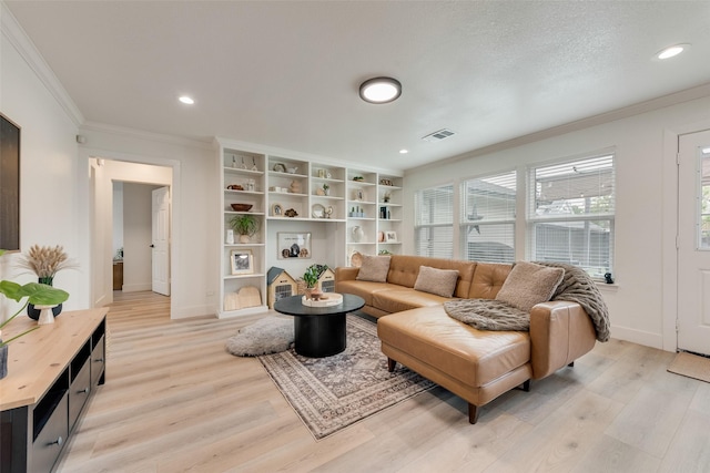 living area with crown molding, visible vents, baseboards, and light wood-type flooring