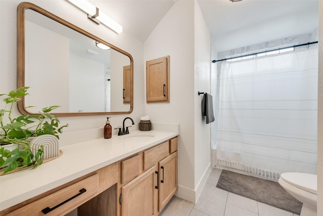bathroom featuring curtained shower, toilet, tile patterned flooring, and vanity