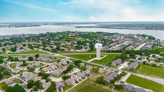 bird's eye view with a residential view and a water view