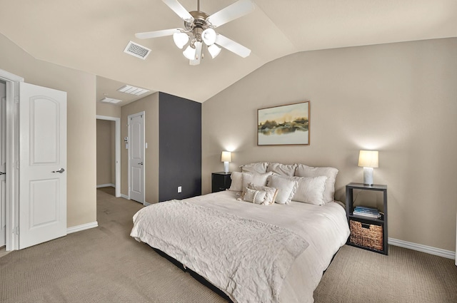 bedroom featuring visible vents, baseboards, vaulted ceiling, and carpet floors