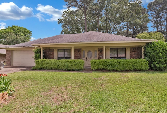 single story home with a front yard, driveway, and an attached garage