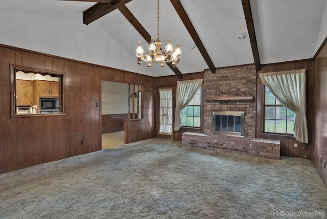 unfurnished living room featuring a chandelier, beamed ceiling, and wooden walls