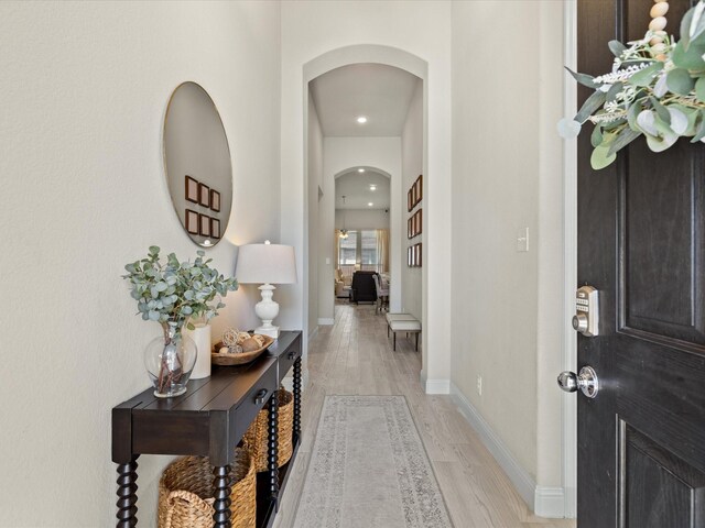 14840 Gentry Dr, Aledo, TX 76008 - foyer with arched walkways, light wood finished floors, baseboards, and recessed lighting