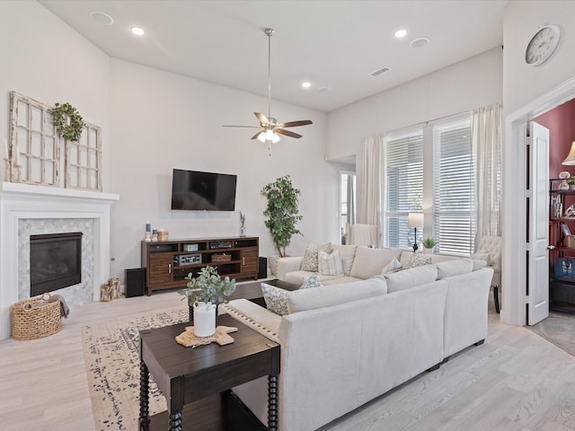 14840 Gentry Dr, Aledo, TX 76008 - living room with wood finished floors, a premium fireplace, ceiling fan, and recessed lighting