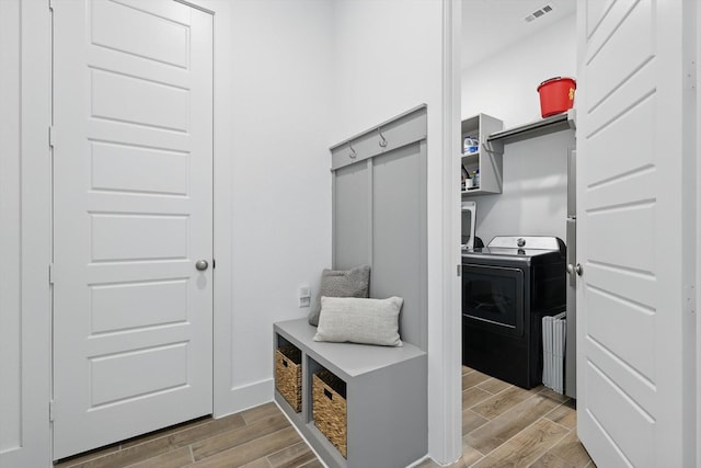 mudroom with visible vents, washer / clothes dryer, and light wood-style flooring
