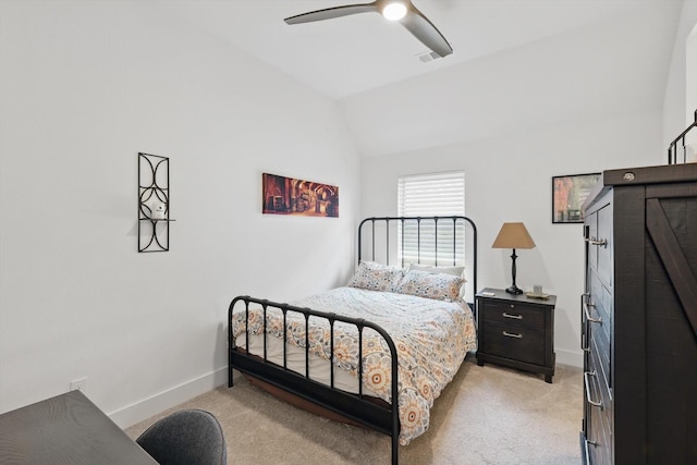 bedroom featuring baseboards, visible vents, light carpet, and lofted ceiling