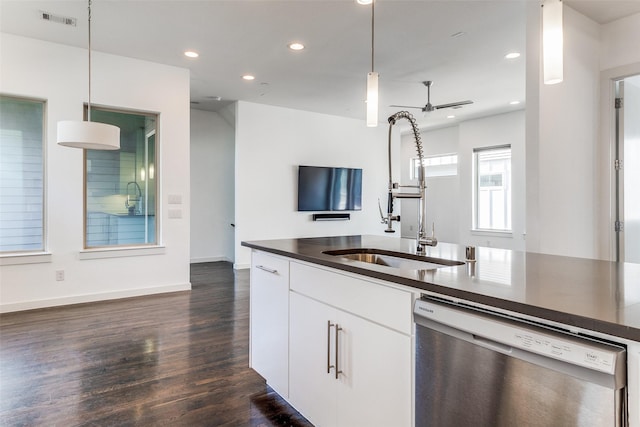 kitchen with a sink, visible vents, dark countertops, dishwasher, and open floor plan