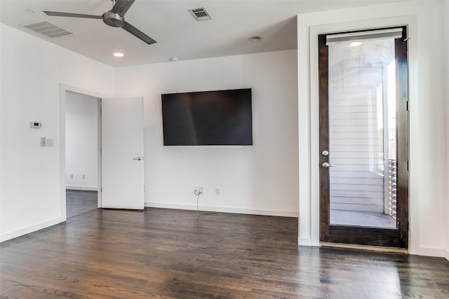 unfurnished living room featuring baseboards, visible vents, wood finished floors, and a ceiling fan