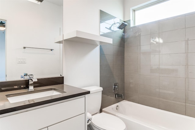 bathroom with toilet, bathtub / shower combination, and vanity