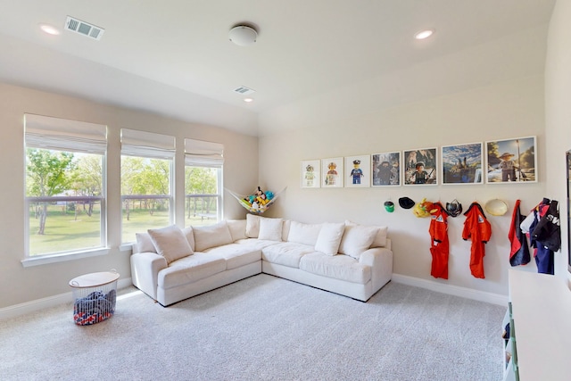 carpeted living area featuring visible vents, recessed lighting, and baseboards