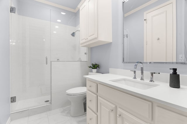 bathroom with toilet, vanity, a shower stall, and crown molding