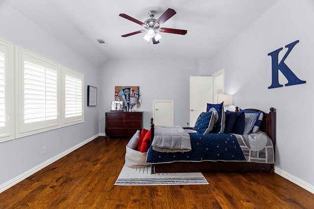 bedroom with wood finished floors, visible vents, and baseboards