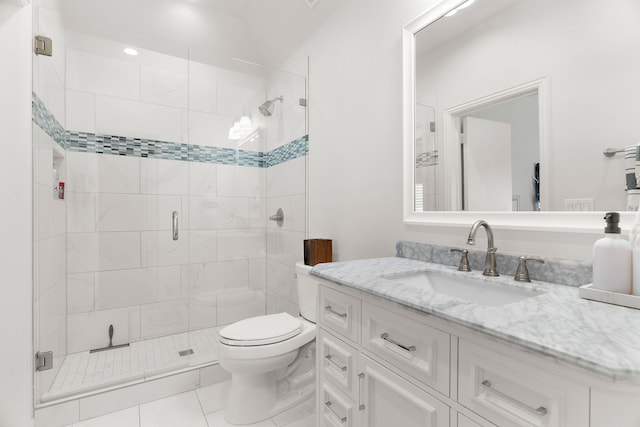 bathroom with toilet, a stall shower, tile patterned flooring, and vanity