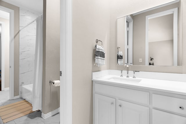 bathroom with baseboards, shower / tub combo with curtain, vanity, and marble finish floor