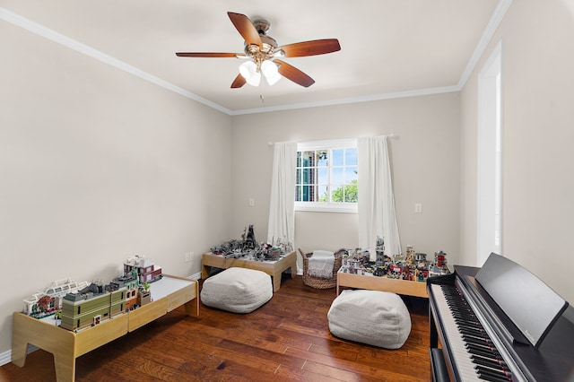 game room featuring crown molding, a ceiling fan, and hardwood / wood-style floors