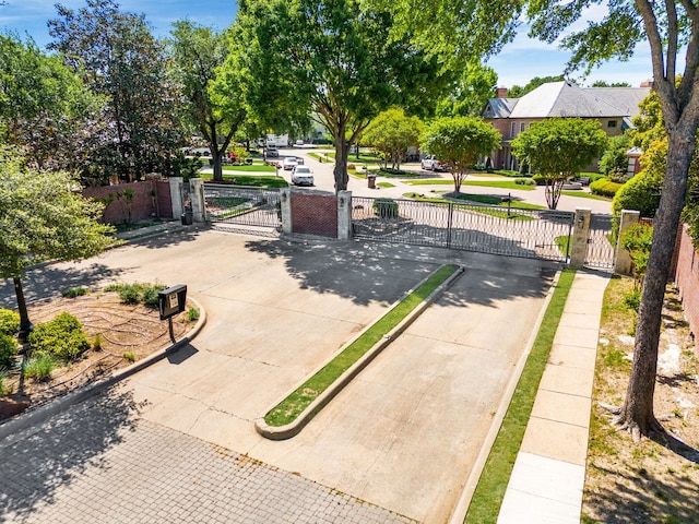 view of gate with fence