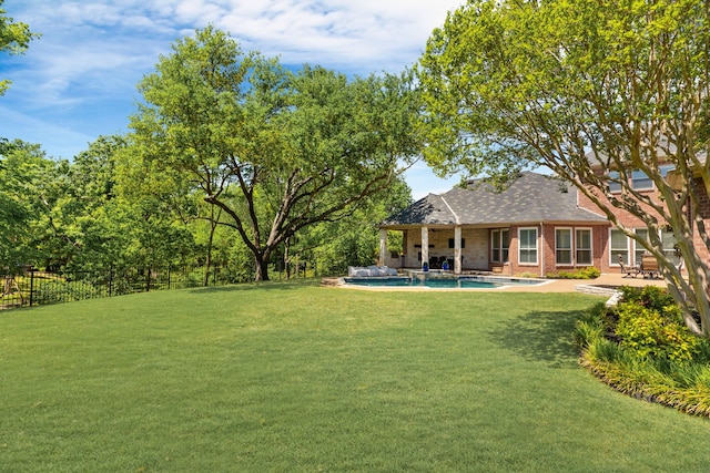 view of yard featuring fence, a patio area, and a fenced in pool
