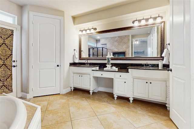 139 Townlake Dr, Prosper, TX 75078 - bathroom featuring tile patterned floors, double vanity, and a garden tub