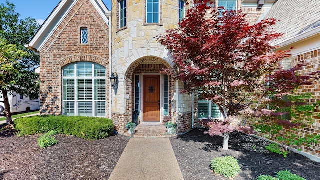 139 Townlake Dr, Prosper, TX 75078 - property entrance with stone siding and brick siding