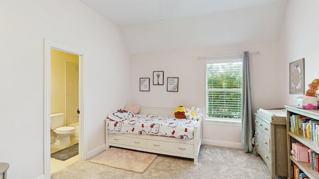 139 Townlake Dr, Prosper, TX 75078 - carpeted bedroom featuring lofted ceiling, ensuite bathroom, and baseboards