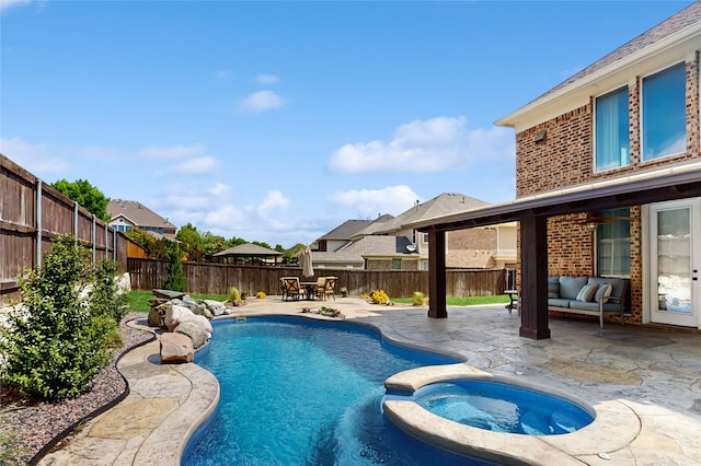 139 Townlake Dr, Prosper, TX 75078 - view of swimming pool with a patio area, a fenced backyard, outdoor lounge area, and a pool with connected hot tub