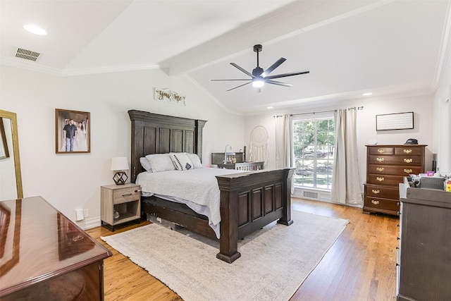 bedroom featuring visible vents, lofted ceiling with beams, a ceiling fan, and light wood-style floors