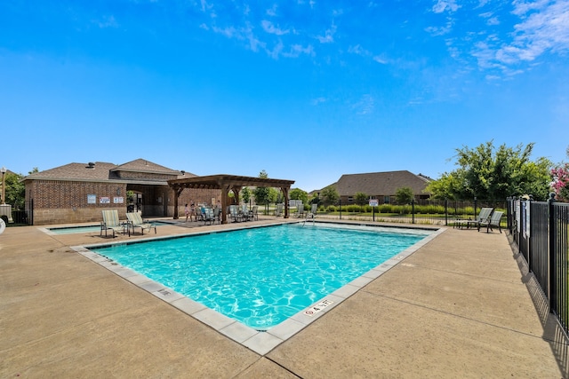 pool with a pergola, a patio, and fence