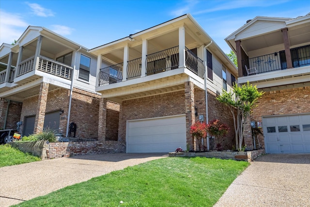5709 Southern Cross Dr, Rockwall, TX 75032 - exterior space with brick siding, an attached garage, driveway, and a balcony