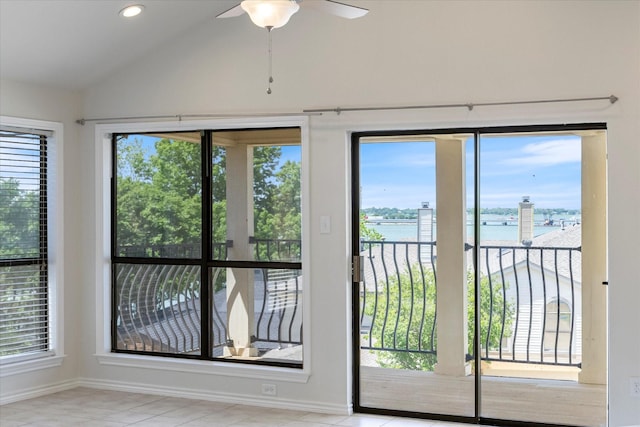 5709 Southern Cross Dr, Rockwall, TX 75032 - entryway featuring a water view, ceiling fan, baseboards, and vaulted ceiling