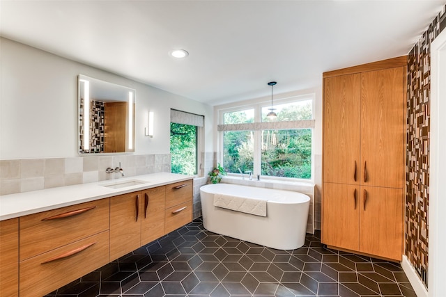 416 Crestwood Dr, Fort Worth, TX 76107 - full bathroom featuring recessed lighting, tile patterned floors, a freestanding bath, tile walls, and vanity