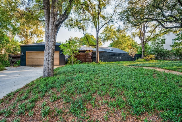 416 Crestwood Dr, Fort Worth, TX 76107 - view of yard featuring driveway, fence, and an attached garage