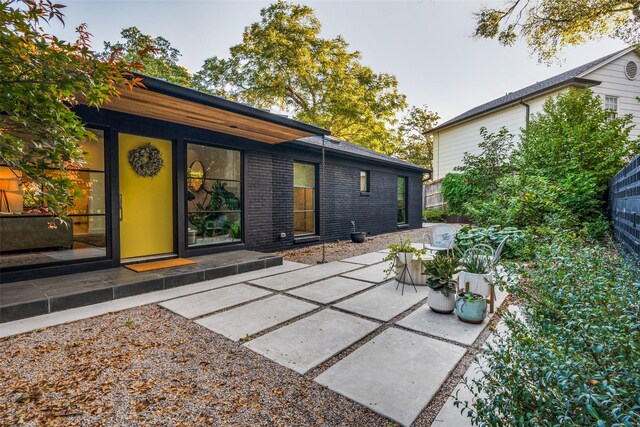 416 Crestwood Dr, Fort Worth, TX 76107 - rear view of house featuring a patio and brick siding