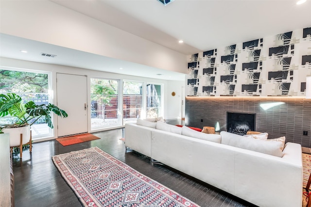 416 Crestwood Dr, Fort Worth, TX 76107 - living room featuring dark wood-style flooring, visible vents, recessed lighting, and a brick fireplace