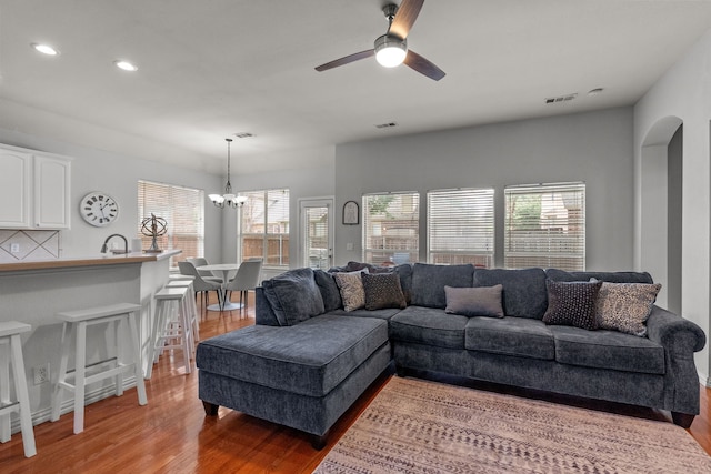 2209 Graystone Ct, Keller, TX 76248 - living area with light wood-type flooring, a ceiling fan, plenty of natural light, recessed lighting, and a chandelier